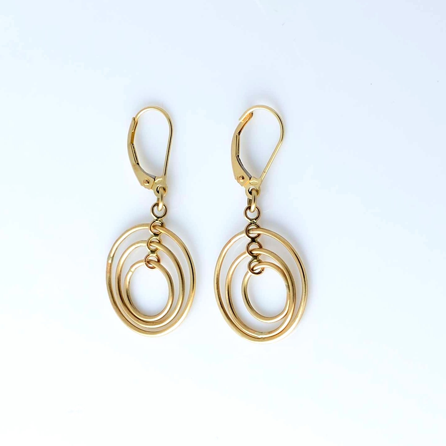 Cochlear gold earrings